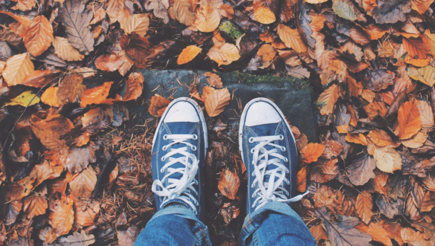 feet in fall leaves